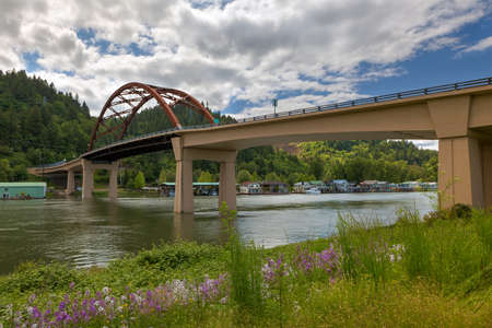 Sauvie Island Bridge with wildflowers over Floating Homes along Multnomah Channel in Portland Oregonの写真素材