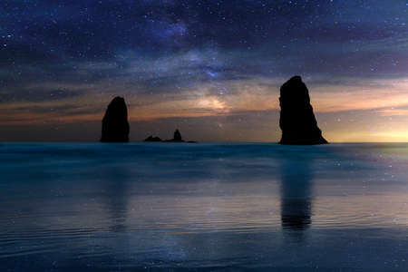 The Needles Rocks at Cannon Beach under starry night sky in Oregon Coastの写真素材
