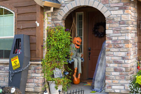 Halloween decoration on house front door entrance in North American suburban neighborhoodの写真素材