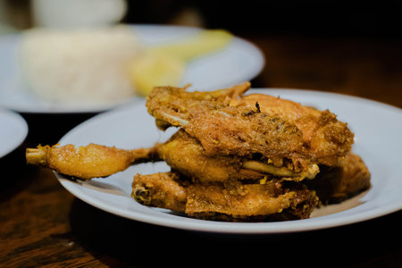 Fried chicken in the white plate, narrow depth of field