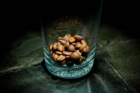 Hi-res photo of a pile of coffee beans which stored in a glass with narrow depth-of-fieldの写真素材