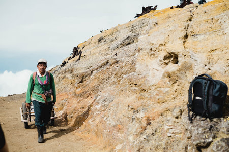 Local resident of Ijen crater drag carts to provide transportation services for tourists who are no longer able to walkのeditorial素材