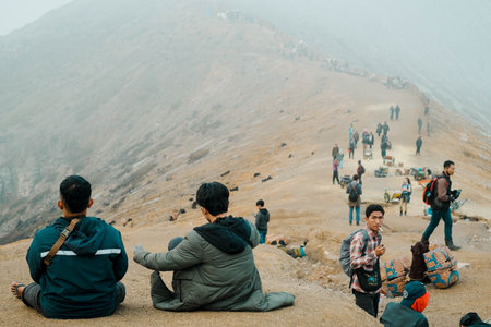 The crowd of visitors from all over the world in the Kawah Ijen or Ijen crater area with foggy conditionのeditorial素材