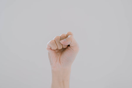 Fist hand on isolated white background. Suitable for background, presentation, commercial. Copy space and cut out.の写真素材