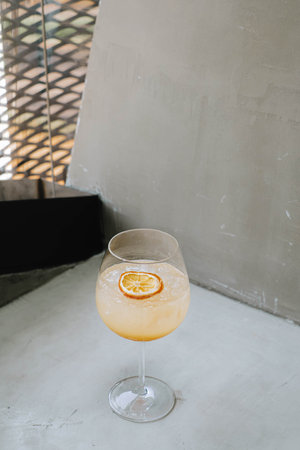 Portrait or vertical and selective focus shot of an Ice Tropical Sangria or Orange Cocktail with...