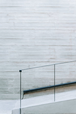 Modern minimalist accessible stairs with black metal railing on an architecture buildingの写真素材