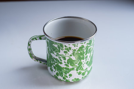 Coffee on an Indonesian vintage-style cup. Isolated white background.の写真素材