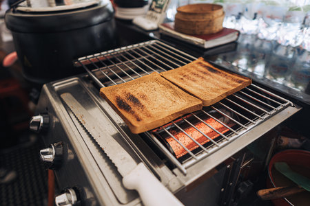 The process of making toast using a gas grill with bokeh background