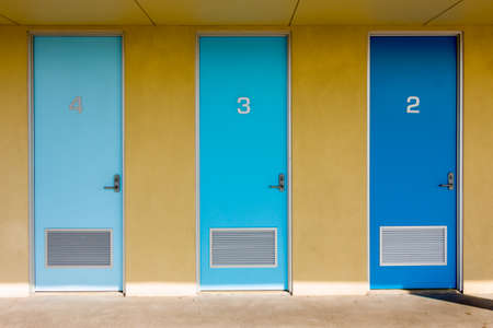 Three doors of different shades of blue.の写真素材