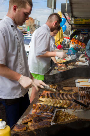 MELBOURNE  AUSTRALIA - SEPTEMBER 5 2015: Hampton Street Fathers Day Car Show - Some street vendors cooking a BBQ for the Hampton Street Fathers Day Car Show in Melbourne.のeditorial素材