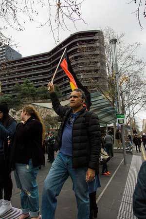 MELBOURNE/AUSTRALIA - 30 JULY , 2016: Protesters rally against the torture and detention of indigious childtren in the Northern Territory. The rally was held outside the State Library.のeditorial素材
