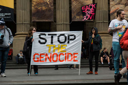 MELBOURNE/AUSTRALIA - 30 JULY , 2016: Protesters rally against the torture and detention of indigious childtren in the Northern Territory. The rally was held outside the State Library.のeditorial素材
