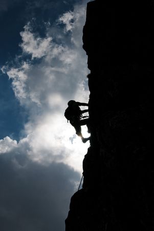 Silhouette of a man during an ascension in Retezat mountains.の写真素材