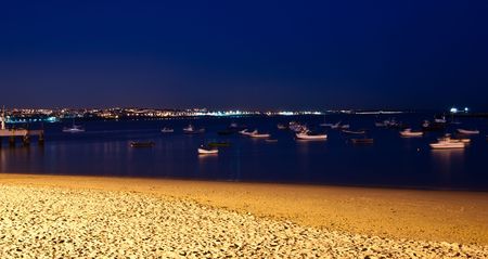 Night  landscape with beach and boats in Praia dos Pescadores (Cascais)