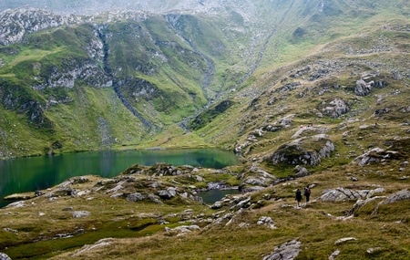 Two Hikers in Fagaras mountains, next to Podragu lakeの写真素材