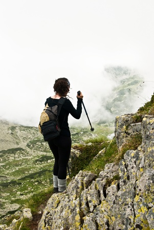 Hiker girl in Retezat mountain, in ascension, to the ridge. の写真素材