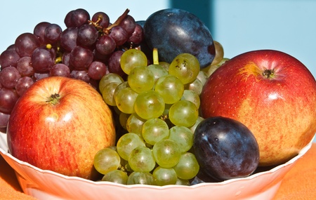 Autumn fruits with apples, grape and plumsの写真素材