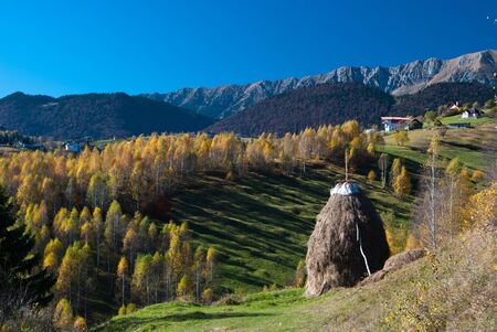 Autumn landscape in an alpine village (Romania)の写真素材