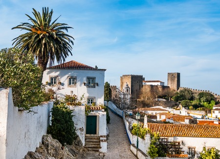 A view of the fortified wall in Obidos, Portugal  The name Obidos probably derives from the Latin term oppidum, meaning citadel, or fortified cityの写真素材