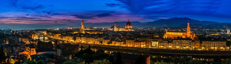 Florence, Italy - skyline view over Arno river with Ponte Vecchio and Palazzo Vecchioの写真素材