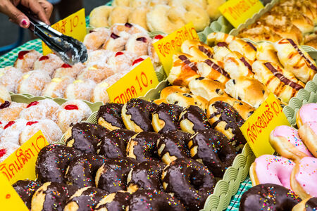 Glazed doughnuts, delicous desert in a nightmarket in Thailand  Ares a type of fried dough confectionery or dessert food  deep-fried from a flour dough, and typically have a ring-shapedの写真素材