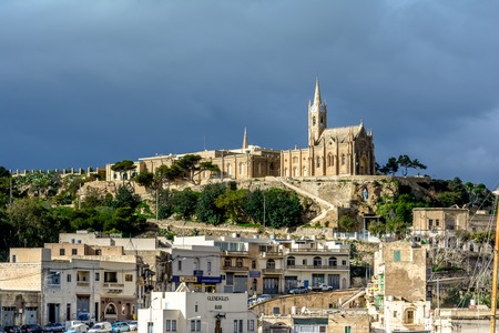 Lourdes Church, a neo-gothic monument built in 1888 on the coastal village of Mgarr on the island of Gozo, Maltaの写真素材