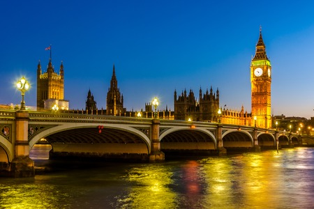 Night view of The  of Westminster with Elizabeth Tower and Westminster Bridge, viewed from across...