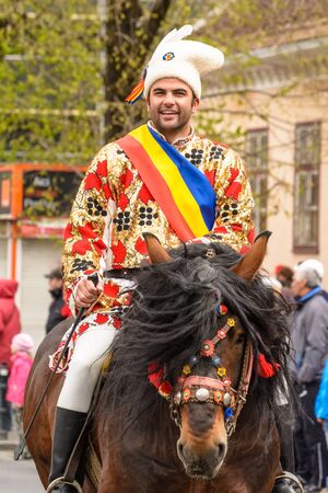 Brasov Romania April 19 2015: Horsemen riding during the traditional parade Juni Brasovului marking the only day of the year when Romanians were permitted to enter in the Saxon town of Kronstadt .のeditorial素材