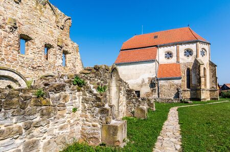 Cart Monastery is a former Cistercian-Benedictine monastery in the Tara Fagarasului region, southern Transylvania, Romania, currently a Lutheran Evangelical church belonging to the local Saxon community. The monastery was probably founded in 1202-1206 by の写真素材