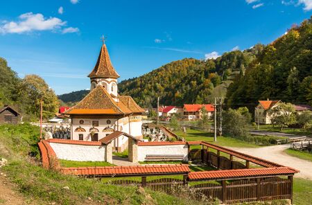 Old church in Simon vilage, in autumn colors in Ban-Moeciu, Romaniaの写真素材