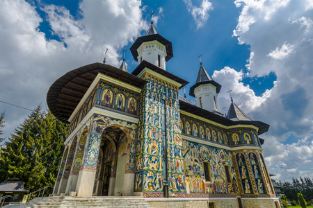 Colorful facade mural painted fresco at Neamt Monastery, Romaniaのeditorial素材