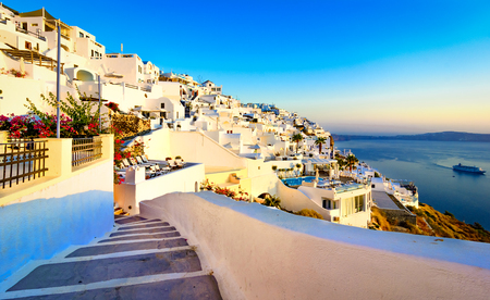 Streets of Fira, Santorini island, Greece. Traditional and famous white houses over the Caldera, Aegean sea.の写真素材