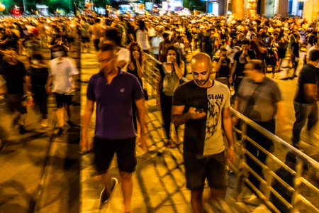 Bucharest, Romania - 10 August 2018: People getting away from the tear gas Thousands of protesters have rallied in cities across Romania against the way Romania is governed by the Social Democrat-PSDのeditorial素材