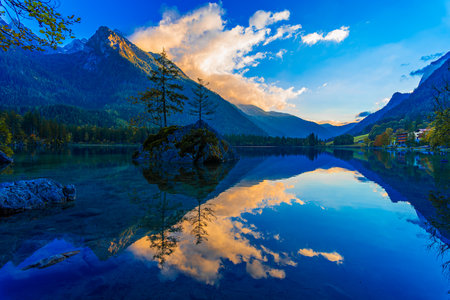 Hintersee, Berchtesgaden National Park, Germany: Sunrise view of an alpine lake in Bavarian Alps of Germany, surrounded by colorful forests, Europeの写真素材