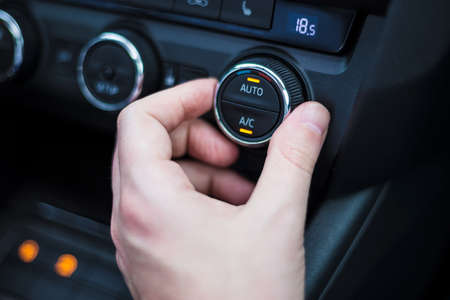 Hand set air condition in the carの写真素材