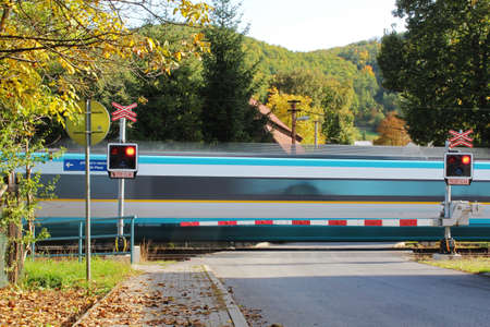 Fast train in motion on railway crossing in autumn