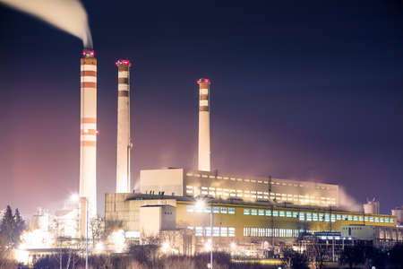 Coal power plant with chimneys on violet skyの写真素材