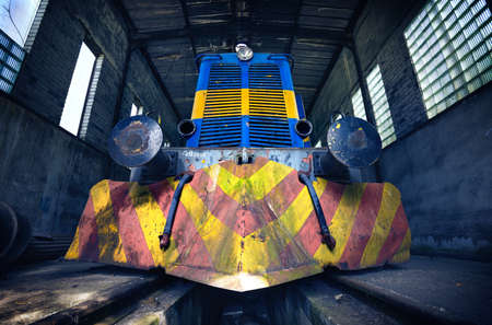 Abandoned diesel locomotive in depot of old mine. Bottom viewの写真素材