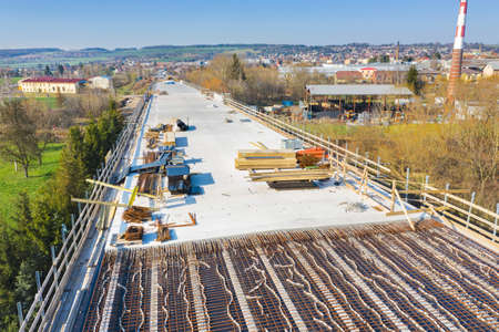 Construction of the new road bridge. Concrete layer with material from above.の写真素材