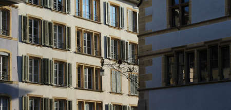 close up of windows on old city houses