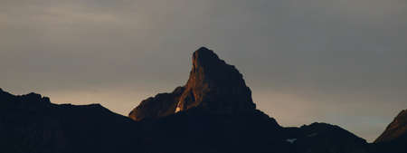 view of a mountain peak in morning light