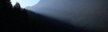 panoramic view of a sunrise in an alpine valley
