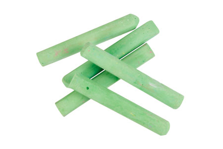 school blackboard chalk pieces isolated on whiteの写真素材