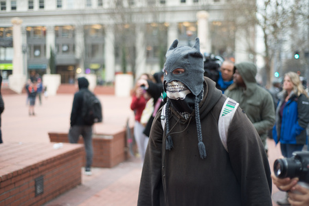 PORTLAND, OREGON JANUARY 25 2017, Protester of the police reaction to inauguration day protests, wearing mask in Pioneer Square.のeditorial素材