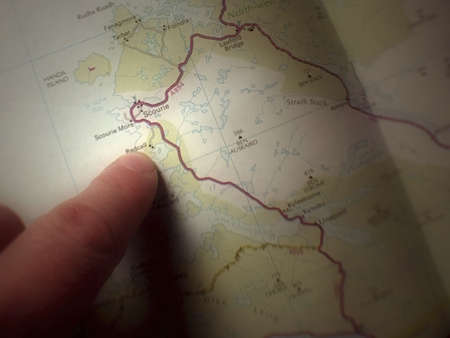 finger pointing at map  map reading road mapの写真素材