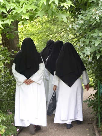 nuns walking through monets garden giverny normandy franceの写真素材