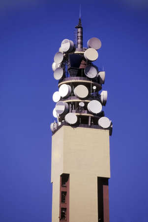 telecommunications tower with satellite dishesの写真素材