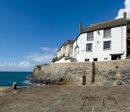 holiday resort town porthleven cornwall england uk the ship inn public house next to the harbourの写真素材