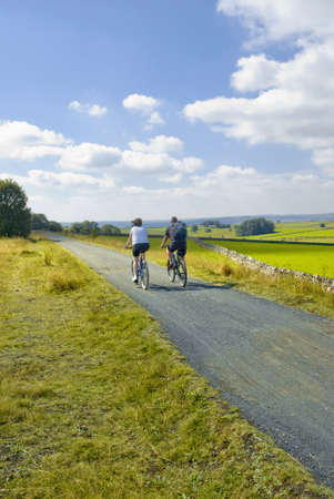 view from the tissington trail cycleway and footpath along disused railway line peak district national park derbyshire england ukの写真素材