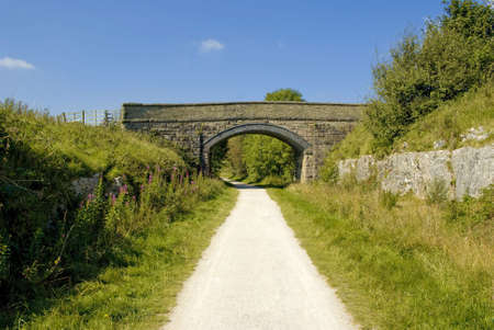 view from the tissington trail cycleway and footpath along disused railway line peak district national park derbyshire england ukの写真素材